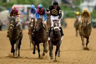 Gary Stevens celebrates atop of Oxbow as he comes to the finish line in Baltimore, Maryland, on May 18, 2013